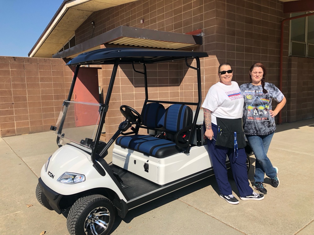 Picture of the new food service  cart and Dayna Gibbs with Sally Stebbins